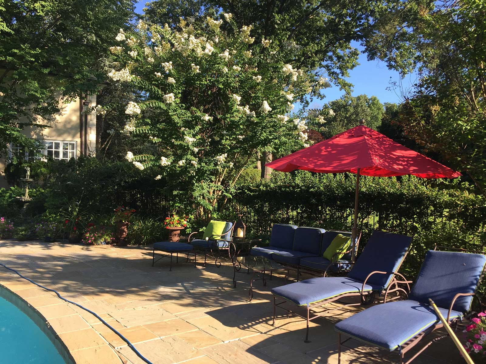 Interior Design for a Pool Patio in Saddle River, NJ by The Red Shutters