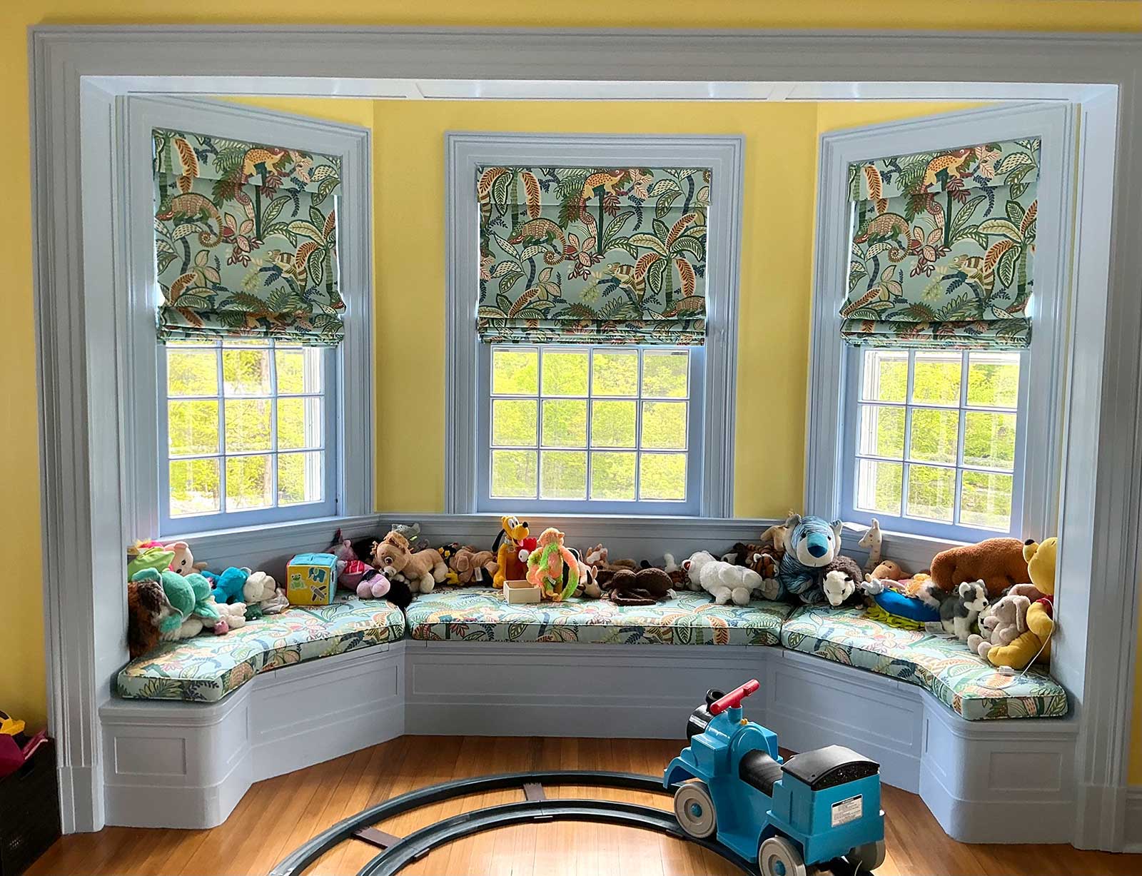 Jungle print roman shades and window seat covers from Westchester County NY interior design project by The Red Shutters