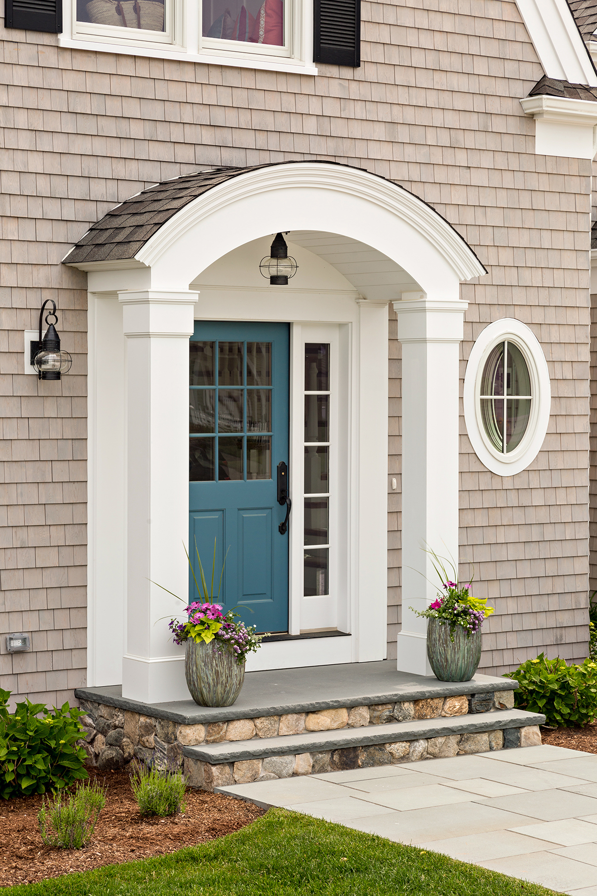 Exterior of a Home on Cape Cod with Blue Door and Onion Lanterns