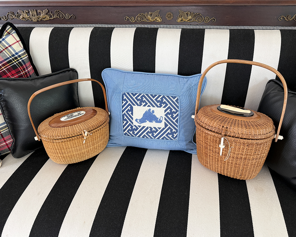 Two Nantucket Friendship Baskets on a Bench with Pillows